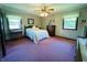 Inviting bedroom with plush carpeting, neutral walls, and a large window, creating a relaxing retreat at 1008 Whispering Trl, Greenfield, IN 46140