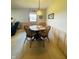 Cozy dining area features a wooden table, comfortable seating, and natural light at 1008 Whispering Trl, Greenfield, IN 46140