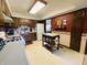 Functional kitchen with laminate countertops, white appliances, and a center island, offering ample workspace at 1008 Whispering Trl, Greenfield, IN 46140