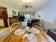 Open living and dining room features comfortable seating, hardwood flooring, and natural light at 1008 Whispering Trl, Greenfield, IN 46140