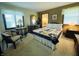 Comfortable main bedroom with a plush bed, dresser, and bright natural light from the large windows at 1008 Whispering Trl, Greenfield, IN 46140