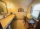 Dedicated sewing room with a long countertop, desk and ample storage, perfect for creative projects at 1008 Whispering Trl, Greenfield, IN 46140