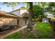 Exterior of home with a stone facade, a small balcony, and a well-maintained lawn and landscaping at 1031 Lancashire Ln, Pendleton, IN 46064