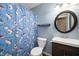 Bright bathroom featuring a playful shark-themed shower curtain and a modern vanity at 1031 Lancashire Ln, Pendleton, IN 46064