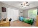 Neutral bedroom with carpet, ceiling fan, and a large closet at 1031 Lancashire Ln, Pendleton, IN 46064