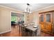 Dining room featuring hardwood floors, an open layout, and stylish furniture at 1031 Lancashire Ln, Pendleton, IN 46064