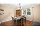 Dining room with hardwood floors, natural light, and a stylish table setting at 1031 Lancashire Ln, Pendleton, IN 46064