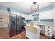 Bright kitchen featuring stainless steel appliances, white cabinetry, and ample counter space at 1031 Lancashire Ln, Pendleton, IN 46064