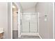 Bathroom featuring a shower with glass doors and a walk-in closet at 10668 Whippoorwill Ln, Indianapolis, IN 46231