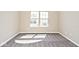 Bedroom space with plush carpet and light-filled window at 10668 Whippoorwill Ln, Indianapolis, IN 46231