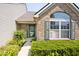 Inviting front entrance with well-maintained landscaping and a combination of brick and siding exterior at 10668 Whippoorwill Ln, Indianapolis, IN 46231