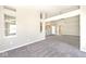 Bright and airy living space featuring plush carpeting and a seamless open-concept design at 10668 Whippoorwill Ln, Indianapolis, IN 46231