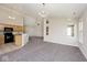 Open-concept eat-in kitchen with adjacent living room and vaulted ceilings at 10668 Whippoorwill Ln, Indianapolis, IN 46231