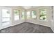 Cozy sunroom with multiple windows and access to the outdoors at 10668 Whippoorwill Ln, Indianapolis, IN 46231