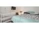 Cozy bedroom with a crib, bed, and a charming decorative mobile for a nurturing environment at 1112 Halifax Ct, Indianapolis, IN 46231