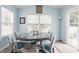 Bright dining area with natural light, a custom table, and seating for six makes a great place to eat at 1112 Halifax Ct, Indianapolis, IN 46231