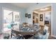 Dining area with patio access and views into the kitchen, offering easy access to the outside at 1112 Halifax Ct, Indianapolis, IN 46231