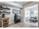 Inviting dining area features modern decor and sleek wood-look tile flooring, perfect for casual meals and entertaining at 1112 Halifax Ct, Indianapolis, IN 46231