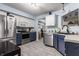Modern kitchen with stainless steel appliances, light countertops, and ample cabinet space, creating a functional cooking space at 1112 Halifax Ct, Indianapolis, IN 46231