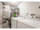 Practical laundry room with a modern washer, dryer, and ample storage at 1112 Halifax Ct, Indianapolis, IN 46231