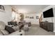 Spacious living room featuring a sectional sofa, modern entertainment center, and ample natural light at 1112 Halifax Ct, Indianapolis, IN 46231
