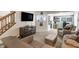 Comfortable living area with soft carpeting, a decorative cabinet, and a view to the kitchen at 1112 Halifax Ct, Indianapolis, IN 46231