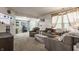 Cozy living room with plush seating, neutral tones, and an open layout leading to additional living spaces at 1112 Halifax Ct, Indianapolis, IN 46231