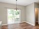 Bright dining area with sliding glass doors leading to an outdoor seating space at 11138 Bear Hollow Dr, Indianapolis, IN 46229