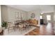 Elegant dining room featuring stylish furniture, hardwood floors, and a decorative wall clock at 11138 Bear Hollow Dr, Indianapolis, IN 46229