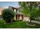 Lovely two-story home with a well manicured lawn, landscaping, and attached two car garage at 11138 Bear Hollow Dr, Indianapolis, IN 46229