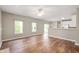 Spacious living area with hardwood floors, lots of natural light, and an open kitchen view at 11138 Bear Hollow Dr, Indianapolis, IN 46229