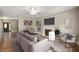 Comfortable living room featuring a plush sectional sofa, fireplace, and modern decor at 11138 Bear Hollow Dr, Indianapolis, IN 46229