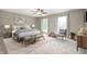 Bright main bedroom featuring a cozy seating area, comfortable bed and lots of light at 11138 Bear Hollow Dr, Indianapolis, IN 46229