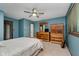 Bedroom featuring wooden furniture set, a ceiling fan, and a view of the backyard at 11354 Royal Pl, Carmel, IN 46032