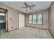 Bedroom with three windows, ceiling fan and trim carpentry. Bathroom located through adjacent door at 11354 Royal Pl, Carmel, IN 46032