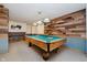 Well-lit game room featuring a billiards table and modern lighting fixtures at 11354 Royal Pl, Carmel, IN 46032