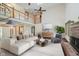 An open-concept living room featuring vaulted ceilings, a fireplace, and modern furnishings at 11354 Royal Pl, Carmel, IN 46032