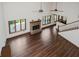 The living room boasts hardwood floors, a fireplace, and tall windows at 11354 Royal Pl, Carmel, IN 46032