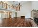 Spacious living room featuring vaulted ceilings, hardwood floors, and a fireplace at 11354 Royal Pl, Carmel, IN 46032