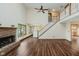 The living room features a brick fireplace, hardwood floors, and a staircase at 11354 Royal Pl, Carmel, IN 46032