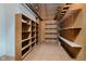 Basement storage area with built-in shelving providing ample storage solutions at 11354 Royal Pl, Carmel, IN 46032
