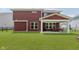View of backyard with a lawn, fence, patio, and the rear of the home at 11840 Crossbill Ct, Noblesville, IN 46060