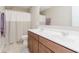 Bathroom with double sink vanity, large mirror and combination tub/shower at 11840 Crossbill Ct, Noblesville, IN 46060