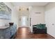 Inviting foyer with hardwood floors, decorative accents, a console table and a bench with throw pillows at 11840 Crossbill Ct, Noblesville, IN 46060