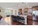Spacious kitchen features an island with seating, stainless steel appliances, and dark wood cabinetry at 11840 Crossbill Ct, Noblesville, IN 46060