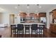 Modern kitchen featuring stainless steel appliances, granite countertops, an island and dark hardwood floors at 11840 Crossbill Ct, Noblesville, IN 46060