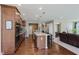 This kitchen has stainless steel appliances, wooden cabinets, granite countertops, and a large center island at 11840 Crossbill Ct, Noblesville, IN 46060