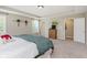 A large primary bedroom with carpeted floors, large windows, and neutral colors, is ready to be customized at 11840 Crossbill Ct, Noblesville, IN 46060