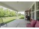 Covered patio with a view of the green backyard at 11840 Crossbill Ct, Noblesville, IN 46060