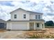 Charming two-story home with a two car garage and inviting front porch at 1207 Mcbride St, Greenfield, IN 46140